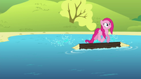 Pinkie Pie on a log floating on a lake S4E18