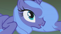 Luna, still lying on the floor, opens her eyes to see Princess Celestia.