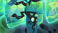 Queen Chrysalis appears from behind cocoons S6E26