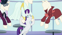 Rarity puts her head between front legs of a mannequin S5E15