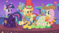 Applejack tries to hide her galoshes from view S1E14
