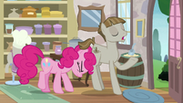 Pinkie Pie pushing Mudbriar out of the store S8E3