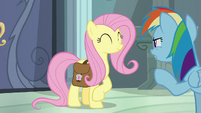 Rainbow looking suspiciously at Fluttershy S9E21