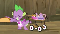 Spike, handing out sweets to the ponies.