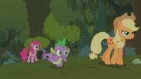 Spike scurries forward through the forest, with the others.
