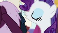 Rarity blows dust from the costume S5E15