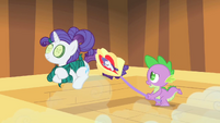 First a shirt, now a fan. How many things with Rarity's face on them DOES Spike have? Well, we're out of time, and that's the story.