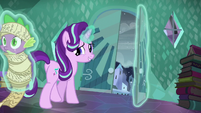 Starlight walking to the door while levitating Spike S6E2