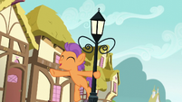 Tender Taps swinging from a lamppost S6E4