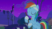 Rainbow Dash sweeps up with a smile S6E7