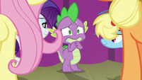 Spike surrounded by ponies and sweating S8E7