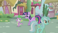 Lyra, walking passed Twilight and Spike.