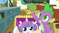 Spike holding Flurry Heart's Whammy toy S7E3