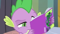 Spike taking a closer look at his comic.