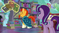 Sunburst levitating the books S6E2