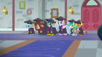 Young Six in graduation gowns S8E26