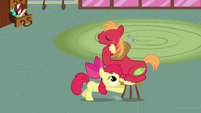 Apple Bloom pushes Big McIntosh's chair S2E17