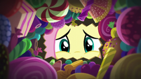 Fluttershy looks inside her candy bag S5E21