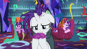 Rarity holding a small clump of hair S7E19