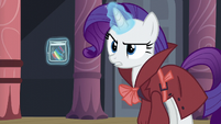 Rarity levitates a piece of Rainbow's mane S5E15