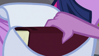 Spike takes book out of Twi's saddlebag S9E5