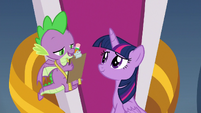 Spike writing on a clipboard S9E24