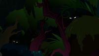 Glowing eyes peering out of the forest S3E9