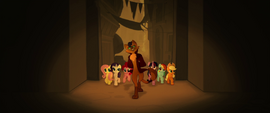 Capper guiding the ponies through town MLPTM