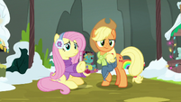 Fluttershy pointing at Flim and Flam's stand MLPBGE