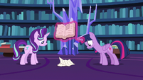 Twilight and Starlight look at crumbling pages S7E14