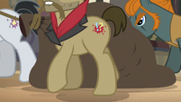 Dr. Caballeron's henchponies hauling a large sack S7E18