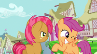 Looking at Scootaloo with not so nice eyes.