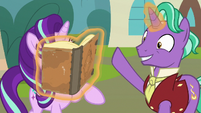 Firelight shoves a book in Starlight's face S8E8