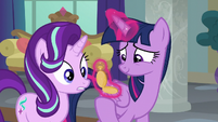 Twilight Sparkle looking at a pocketwatch S8E1