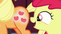 Apple Bloom looks at Applejack's glowing cutie mark S5E17