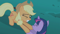 Applejack grasping Twilight's hooves S1E02