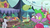 Spike looking at the chaotic marketplace S9E23