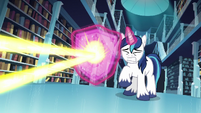 Shining Armor conjures a shield to deflect the magic beam S6E2