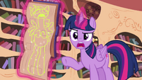 Twilight pointing at a drawing of her S4E21