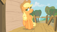 Applejack about to place a hoof on the wall of the club house S1E18