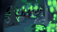 Changelings fly past Discord's hiding spot S6E26