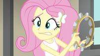 Fluttershy playing tambourine with a worried look EG2