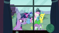 Twilight looks back at her past while her old friends are laughing S5E12