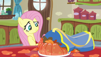 Fluttershy looking at squashed gelatin S6E11