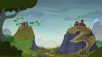 Twilight and Fluttershy hovering between two hills S5E23