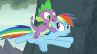 Spike pointing at gorge-surfing dragons S7E25