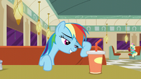 Rainbow Dash leaning against her seat S6E9
