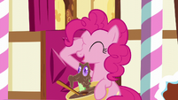 Pinkie with hoof on her right eye; Gummy pops out of the bowl S5E19