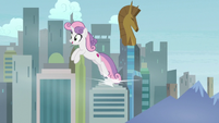 Sweetie Belle leaping over a cityscape S9E22