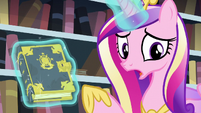 Cadance points at the tome while showing it to Twilight S6E2